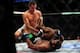 Jun 14, 2014; Vancouver, British Columbia, Canada; Rory MacDonald (red) fights Tyron Woodley (blue) during the Welterweigtht bout at UFC 174 at Rogers Arena. Rory MacDonald defeats Tyron Woodley via unanimous decision. Mandatory Credit: Anne-Marie Sorvin