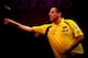 LONDON, ENGLAND - DECEMBER 15: Dave Chisnall of England in action during day three of the Ladbrokes.com World Darts Championships at Alexandra Palace on December 15, 2013 in London, England. (Photo by Ben Hoskins/Getty Images)