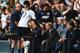 LONDON, ENGLAND - AUGUST 24: Emmanuel Adebayor of Spurs shakes hands with Harry Redknapp, the QPR manager during the Barclays Premier League match between Tottenham Hotspur and Queens Park Rangers at White Hart Lane on August 24, 2014 in London, England.