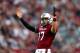 COLUMBIA, SC - NOVEMBER 23: Dylan Thompson #17 of the South Carolina Gamecocks celebrates after throwing a touchdown during their game against the Coastal Carolina Chanticleers at Williams-Brice Stadium on November 23, 2013 in Columbia, South Carolina.