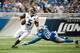 Aug 22, 2014; Detroit, MI, USA; Jacksonville Jaguars quarterback Blake Bortles (5) gets away from Detroit Lions defensive end George Johnson (68) during the third quarter at Ford Field. Mandatory Credit: Tim Fuller-USA TODAY Sports