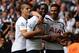 LONDON, ENGLAND - AUGUST 24: Emmanuel Adebayor of Spurs celebrates his goal with team mates during the Barclays Premier League match between Tottenham Hotspur and Queens Park Rangers at White Hart Lane on August 24, 2014 in London, England. (Photo by Ja