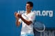 NEW YORK, NY - AUGUST 23: Novak Djokovic of Serbia cheers during Arthur Ashe Kids' Day prior to the start of the 2014 U.S. Open at the USTA Billie Jean King National Tennis Center on August 23, 2014 in the Flushing neighborhood of Queens in New York City.