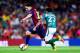 BARCELONA, SPAIN - AUGUST 18: Lionel Messi of FC Barcelona competes for the ball with Jose Juan Vazquez of Club Leon during the Joan Gamper Trophy match between FC Barcelona and Club Leon at Camp Nou on August 18, 2014 in Barcelona, Spain. (Photo by Dav