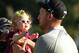 PARAMUS, NJ - AUGUST 24: Hunter Mahan holds his daughter Zoe celebrates as he celebrates finishing on the 18th green during the final round of The Barclays at The Ridgewood Country Club on August 24, 2014 in Paramus, New Jersey. (Photo by Hunter Martin/