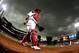 Jul 7, 2014; St. Louis, MO, USA; St. Louis Cardinals catcher Yadier Molina (4) walks off the field as rain falls during the first inning against the Pittsburgh Pirates at Busch Stadium. Mandatory Credit: Jeff Curry-USA TODAY Sports