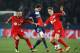 PARIS, FRANCE - MARCH 12: Adrien Rabiot of Paris Saint-Germain (C) battles with Omer Toprak (L) and Philipp Wollscheid of Bayer Leverkusen (R) during the UEFA Champions League Round of 16 second leg match between Paris Saint-Germain FC and Bayer Leverkus