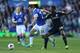 LIVERPOOL, ENGLAND - SEPTEMBER 14: Seamus Coleman of Everton holds off Samuel Eto'o of Chelsea during the Barclays Premier League match between Everton and Chelsea at Goodison Park on September 14, 2013 in Liverpool, England. (Photo by Clive Brunskill/G
