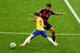 BELO HORIZONTE, BRAZIL - JULY 08: Bernard of Brazil and Sami Khedira of Germany compete for the ball during the 2014 FIFA World Cup Brazil Semi Final match between Brazil and Germany at Estadio Mineirao on July 8, 2014 in Belo Horizonte, Brazil. (Photo