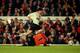 24 Mar 1999: Robbie Fowler of Liverpool is brought down by Arsenal goalkeeper David Seaman during the FA Carling Premiership match at Highbury in London. Liverpool were awarded a penalty despite the striker's admission that no contact had been made. Seam
