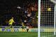NORWICH, ENGLAND - NOVEMBER 17: Anthony Pilkington of Norwich City scores his opening goal past goalkeeper Anders Lindegaard of Manchester United during the Barclays Premier League match between Norwich City and Manchester United at Carrow Road on Novemb