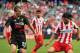 CHICAGO, IL - JULY 27: Chori Alejandro Dominguez #10 of Olympiacos FC is defended by Lucas Leiva #21 of Liverpool in the second half during the International Champions Cup 2014 on July 27, 2014 at Soldier Field in Chicago, Illinois. Liverpool defeated Oly