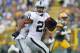 GREEN BAY, WI - AUGUST 22: Maurice Jones Drew #21 of the Oakland Raiders looks back as he runs for a touchdown during the first quarter of a preseason game against the Green Bay Packers at Lambeau Field on August 22, 2014 in Green Bay, Wisconsin. (Photo