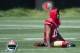 July 24, 2014; Santa Clara, CA, USA; San Francisco 49ers wide receiver Michael Crabtree (15) stretches during training camp at the SAP Performance Facility. Mandatory Credit: Kyle Terada-USA TODAY Sports