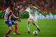 LISBON, PORTUGAL - MAY 24: Angel Di Maria of Real Madrid takes on Juanfran (L) and Jose Sosa of Club Atletico de Madrid (C) during the UEFA Champions League Final between Real Madrid and Atletico de Madrid at Estadio da Luz on May 24, 2014 in Lisbon, Por