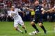 Aug 10, 2013; St. Louis, MO, USA; Inter Milan midfielder Esteban Cambiasso (19) controls the ball away from Real Madrid midfielder Angel Di Maria (22). Mandatory Credit: Scott Rovak-USA TODAY Sports