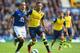 LIVERPOOL, ENGLAND - AUGUST 23: Alex Oxlade-Chamberlain of Arsenal in action with Leon Osman of Everton during the Barclays Premier League match between Everton and Arsenal at Goodison Park on August 23, 2014 in Liverpool, England. (Photo by Laurence G