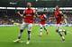 HULL, ENGLAND - APRIL 20: Lukas Podolski (L) of Arsenal celebrates with team mates Olivier Giroud (R) and Bacary Sagna (C) after scoring his sides third goal during the Barclays Premier League match between Hull City and Arsenal at KC Stadium on April 20