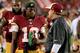 LANDOVER, MD - AUGUST 18: Quarterback Robert Griffin III #10 of the Washington Redskins talks with head coach Jay Gruden of the Washington Redskins during a preseason game against the Cleveland Browns at FedExField on August 18, 2014 in Landover, Marylan