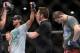 Jun 7, 2014; Albuquerque, NM, USA; Benson Henderson (red) celebrates his victory over Rustam Khabilov (blue) after their lightweight bout during UFC Fight Night 42 at Tingley Coliseum. Henderson won via fourth round submission. Mandatory Credit: Joe Campo