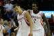HOUSTON, TX - NOVEMBER 11: Jeremy Lin #7 and Patrick Beverley #2 of the Houston Rockets celebrate as time winds down in the second overtime period during the game against the Toronto Raptors at Toyota Center on November 11, 2013 in Houston, Texas. NOTE T