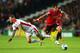 MILTON KEYNES, ENGLAND - AUGUST 26: Javier Hernandez of Manchester United goes past Kyle McFadzean of Milton Keynes Dons during the Capital One Cup Second Round match between MK Dons and Manchester United at Stadium mk on August 26, 2014 in Milton Keynes,