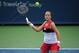 CINCINNATI, OH - AUGUST 09: Shelby Rogers returns to Zarina Diyas of Kazakhstan during day 1 of the Western and Southern Open on August 9, 2014 in Cincinnati, Ohio. (Photo by Jonathan Moore/Getty Images)