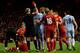 LIVERPOOL, ENGLAND - NOVEMBER 27: Mario Balotelli of Manchester City is shown a red card by Referee Martin Atkinson during the Barclays Premier League match between Liverpool and Manchester City at Anfield on November 27, 2011 in Liverpool, England. (Ph