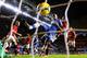 LONDON, ENGLAND - JANUARY 19: (EDITORS NOTE: Retransmission of #463789677 with alternate crop.) Samuel Eto'o of Chelsea scores his team's third goal and completes his hat trick despite the challenge from Antonio Valencia of Manchester United during the