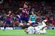 BARCELONA, SPAIN - AUGUST 18: Munir jumps over Christian Martinez of Club Leon during the Joan Gamper Trophy match between FC Barcelona and Club Leon at Camp Nou on August 18, 2014 in Barcelona, Spain. (Photo by David Ramos/Getty Images)
