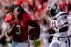 Sep 7, 2013; Athens, GA, USA; Georgia Bulldogs running back Todd Gurley (3) runs after losing his helmet past South Carolina Gamecocks linebacker T.J. Holloman (11) during the second quarter at Sanford Stadium. Mandatory Credit: Dale Zanine-USA TODAY Spo