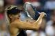 NEW YORK, NY - AUGUST 25: Maria Sharapova of Russia returns a shot against Maria Kirilenko of Russia during her women's singles first round match on Day One of the 2014 US Open at the USTA Billie Jean King National Tennis Center on August 25, 2014 in th