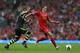 LIVERPOOL, ENGLAND - AUGUST 17: Daniel Agger of Liverpool moves away from Glenn Whelan of Stoke City during the Barclays Premier League match between Liverpool and Stoke City at Anfield on August 17, 2013 in Liverpool, England. (Photo by Clive Brunskill/G