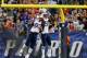 FOXBORO, MA - AUGUST 22: Tommy Kelly #93 and Chandler Jones #95 of the New England Patriots celebrate in the first quarter against Carolina Panthers in a preseason game at Gillette Stadium on August 22, 2014 in Foxboro, Massachusetts. (Photo by Jim Rogash