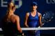 NEW YORK, NY - AUGUST 26: Catherine Bellis (R) of the United States walks to the net after defeating Dominika Cibulkova of Slovakia during their women's singles first round match on Day Two of the 2014 US Open at the USTA Billie Jean King National Tennis