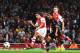 LONDON, ENGLAND - AUGUST 27: Alexis Sanchez (left) of Arsenal shoots and scores past Tolga Zengin the Besiktas goalkeeper during the UEFA Champions League Qualifier 2nd leg match between Arsenal and Besiktas at the Emirates Stadium on August 27, 2014 in