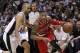 SAN ANTONIO, TX - MAY 14: Damian Lillard #0 of the Portland Trail Blazers drives around Tony Parker #9 of the San Antonio Spurs in Game Five of the Western Conference Semifinals during the 2014 NBA Playoffs at the AT&T Center on May 14, 2014 in San Anton