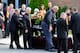 TURIN, NY - AUGUST 14: Pallbearers help to carry the casket of sprint car driver Kevin Ward Jr. at South Lewis Senior High School on August 14, 2014 in Turin, New York. Ward was killed August 9, when he exited his car during a dirt track race and was str