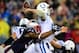 Jan 11, 2014; Foxborough, MA, USA; Indianapolis Colts quarterback Andrew Luck (12) throws a pass while being hit by New England Patriots outside linebacker Jamie Collins (91) during the third quarter of the 2013 AFC divisional playoff football game at Gi