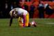 DENVER, CO - OCTOBER 27: Quarterback Robert Griffin III #10 of the Washington Redskins goes to his knees after throwing an interception during the fourth quarter against the Denver Broncos at Sports Authority Field Field at Mile High on October 27, 2013