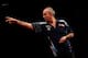LONDON, ENGLAND - MAY 22: Phil Taylor of England in action during the McCoys Premier League Darts Play-Offs Semi Final match between Raymond van Barneveld and Phil Taylor at O2 Arena on May 22, 2014 in London, England. (Photo by Ben Hoskins/Getty Images
