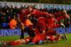 LONDON, ENGLAND - DECEMBER 15: Jon Flanagan of Liverpool is mobbed by his team mates after scoring their third goal during the Barclays Premier League match between Tottenham Hotspur and Liverpool at White Hart Lane on December 15, 2013 in London, Englan