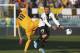 Moras (right) in action for Verona