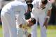 CAPE TOWN, SOUTH AFRICA - MARCH 01: Michael Clarke of Australia goes down after getting hit by a delivery from Morne Morkel of South Africa during day one of the third test match between South Africa and Australia at Newlands cricket ground on March 1, 2