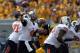 Sep 28, 2013; Morgantown, WV, USA; Oklahoma State Cowboys quarterback J.W. Walsh (4) passes the ball against the West Virginia Mountaineers at Milan Puskar Stadium. Mandatory Credit: Peter Casey-USA TODAY Sports