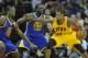 Dec 29, 2013; Cleveland, OH, USA; Cleveland Cavaliers power forward Tristan Thompson (13) dribbles the ball in front of Golden State Warriors small forward Harrison Barnes (40) and small forward Draymond Green (23) in the third quarter at Quicken Loans Ar