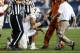 PROVO, UT - SEPTEMBER 7: Quarterback David Ash #14 of the Texas Longhorns is assisted by trainers after he was hurt on a play against the BYU Cougars during the second half of an NCAA football game September 7, 2013 at LaVell Edwards Stadium in Provo, Uta