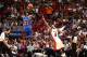MIAMI, FL - APRIL 6: Iman Shumpert #21 of the New York Knicks shoots against LeBron James #6 of the Miami Heat during a game on April 6, 2014 at American Airlines Arena in Miami, Florida. NOTE TO USER: User expressly acknowledges and agrees that, by down