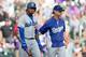 DENVER, CO - JUNE 7: Manager Don Mattingly consoles Hanley Ramirez #13 of the Los Angeles Dodgers after Ramirez struck out during the ninth inning against the Colorado Rockies at Coors Field on June 7, 2014 in Denver, Colorado. The Rockies defeated the D