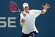 NEW YORK, NY - AUGUST 26: John Isner of the United States returns a shot against Marcos Giron of the United States during their men's singles first round match on Day Two of the 2014 US Open at the USTA Billie Jean King National Tennis Center on August 2